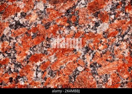 Red granite tile texture close up. Nature granite texture background. Polished decorative stone for photo design. Macro red grey granite decorative ti Stock Photo