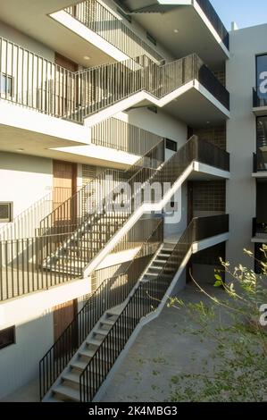 stairs apartment building, white building income wooden doors, central courtyard, mexico Stock Photo