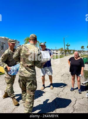 Florida Army National Guard Soldiers from 1-265 Air Defense Artillery (ADA) deliver food to neighborhoods in Placida, Fla., by Hurricane Ian, October 2, 2022. We have forces operating throughout the state, providing assistance to the areas of greatest need. Stock Photo