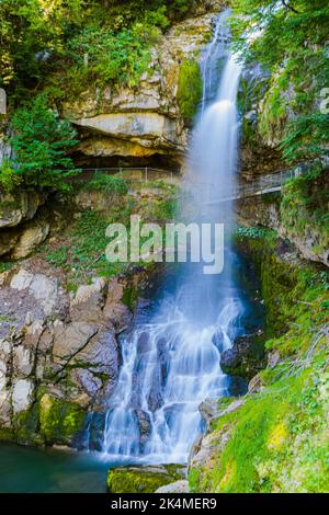 The Giessbach rises in the high valleys and basins of the Faulhorn-Sägistal area and flows into the world-famous Giessbach Falls, which plunge into La Stock Photo