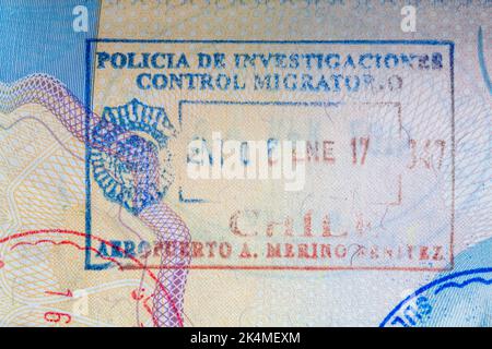 Policia de Investigaciones Control Migratorio Aeropuerto A Merino Benitez Chile stamp in British passport - Investigative Police Immigration Control Stock Photo