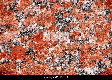 Red granite tile texture close up. Nature granite texture background. Polished decorative stone for photo design. Macro red grey granite decorative ti Stock Photo