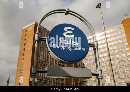 Eccles shopping centre sign with large offices in background Stock Photo