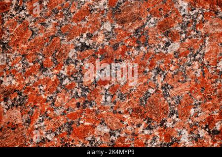 Nature granite texture background. Red granite tile texture close up. Polished decorative stone for photo design. Macro red grey granite decorative ti Stock Photo