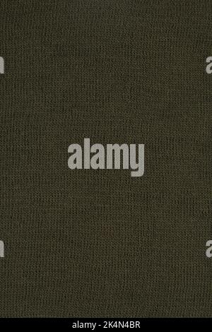 Seamless wool pattern. Close-up khaki yarn fabric, knitted texture. Texture of khaki wool fabric. Stock Photo