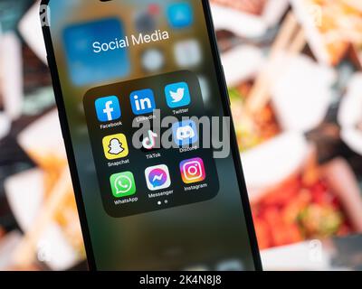 Galati, Romania - October, 03 2022: Mobile app icons of social media services are seen on a smartphone, including Facebook, LinkedIn, Twitter, Snapcha Stock Photo