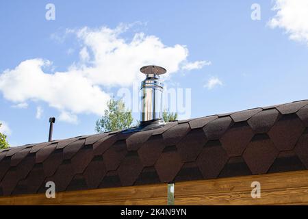Metal stove pipe on the roof close up Stock Photo
