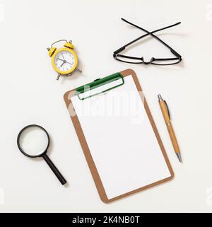 Wooden clipboard with empty paper and wood cover pen isolated cutout on white background. Space for text clipping path. Advertising template Stock Photo
