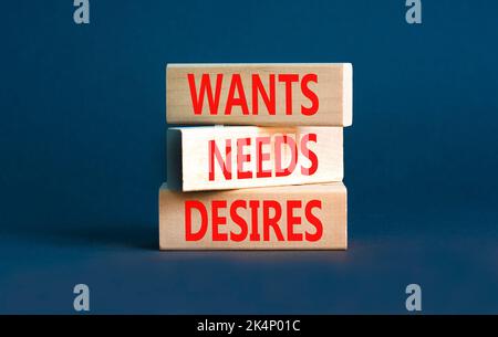 Wants needs and desires symbol. Concept words Wants Needs Desires on wooden blocks. Beautiful grey table grey background. Business, psychological want Stock Photo