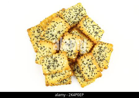 Group of square shape wheat crackers covered with seeds isolated on white background Stock Photo