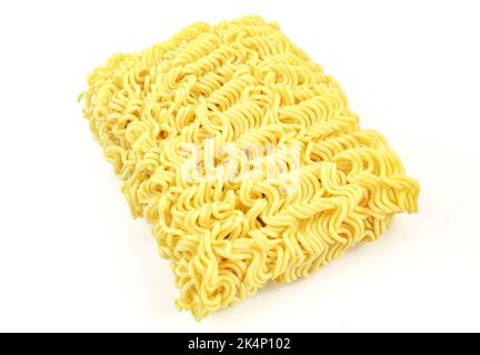 Uncooked asian ramen pasta block isolated on white background. Raw noodles Stock Photo