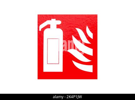 Fire extinguisher sign sticker on wall. Warning caution symbol Stock Photo