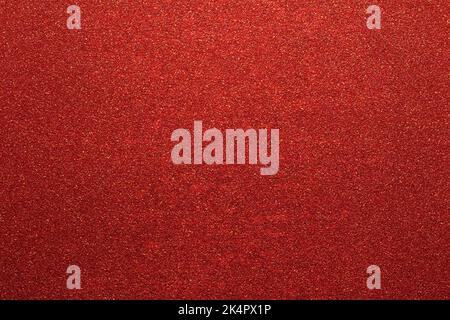dark red color glitter paper abstract, natural grunge texture background Stock Photo