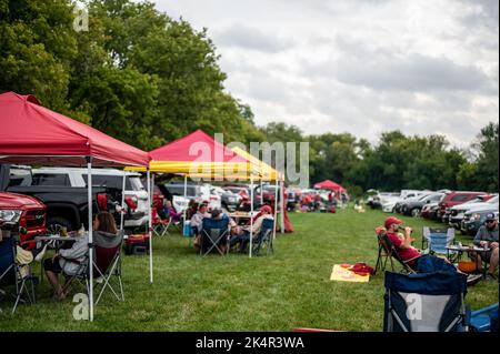 Ames, Iowa, USA - 9.2022 - Selective focus on lawn chair with I-State Logo at a football tailgate.  Stock Photo