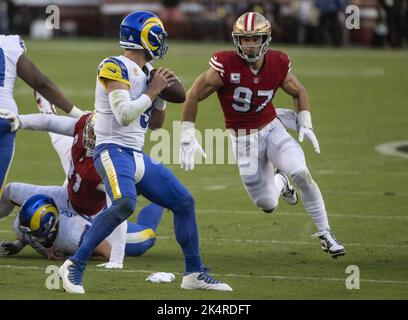 Los Angeles, CA, USA. 30th Jan, 2022. San Francisco 49ers defensive end  Nick Bosa (97) tries to tackles Los Angeles Rams running back Cam Akers  (23) In the first quarter during the