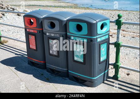 Criccieth, UK- July 13, 2022: Recycling bins in the village of Criccieth in North Wales. Stock Photo
