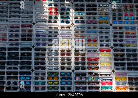 Sunglasses on display at local market Stock Photo