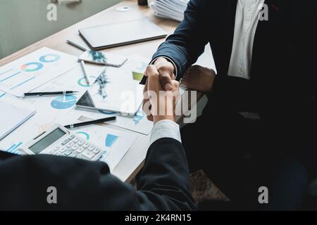 Businessman handshake for teamwork of business merger and acquisition,successful negotiate, two businessman shake hand with partner to celebration Stock Photo