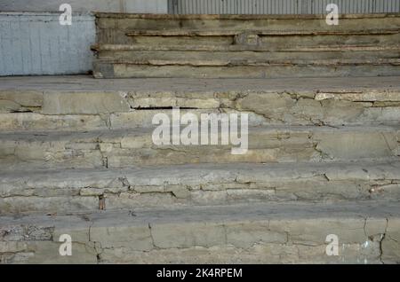 Old ruined steps on the porch of the building outside Stock Photo