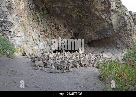 Rock zen pyramid near Geghard monastery. Stones stacked on top of each other in the form of a pyramid Stock Photo