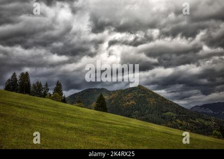 Stormy clouds on sky and hill at background. Autumn country. Stock Photo