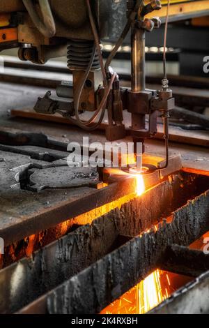 CNC machine cutting the metal plate. The hi-technology sheet metal manufacturing process Stock Photo