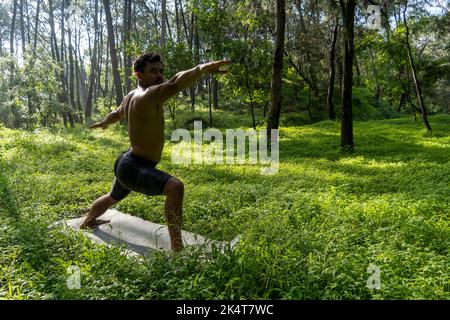 mexican man doing yoga and stretching in the forest, mexico Stock Photo