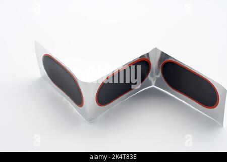 Puncture patches for bike. Close-up. On white background. Stock Photo