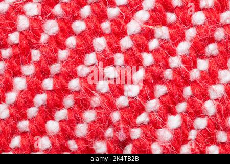 Handmade knitted fabric. red and white woolen background Stock Photo