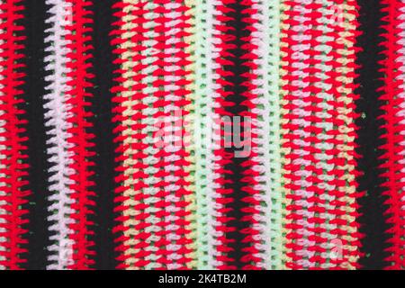 Knitted background from colored threads close up Stock Photo