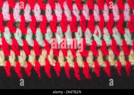 Knitted background from colored threads close up. homemade needlework Stock Photo
