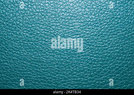 Blue colored leather surface background close up Stock Photo