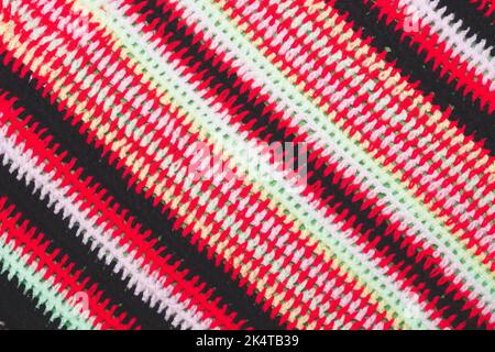 Knitted background from colored threads close up Stock Photo