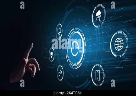 Software and hardware upgrade concept. The hand touches the hologram. Stock Photo