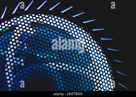 Detail of computer fan with blue color light abstract background. cooler grid close up. rgb led illumination Stock Photo