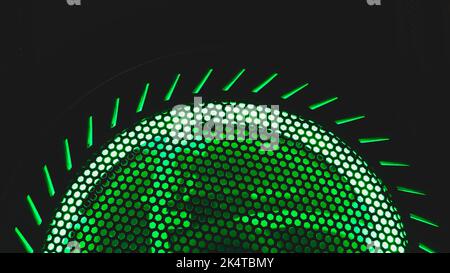 Detail of computer fan with green light abstract background. cooler grid close up. rgb led illumination Stock Photo