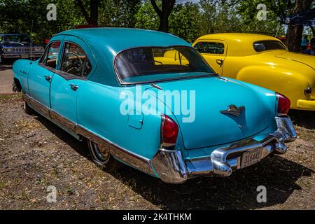 Falcon Heights, MN - June 18, 2022: High perspective rear corner view of a 1953 Kaiser Manhattan 4 Door Sedan at a local car show. Stock Photo