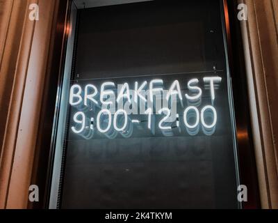 cafe neon breakfast sign from nine in the morning to noon Stock Photo