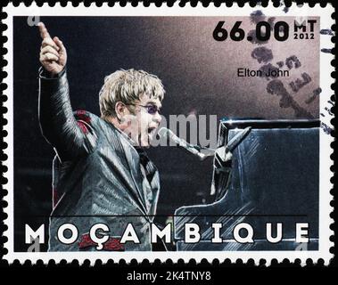 Elton John on postage stamp of Mozambique Stock Photo