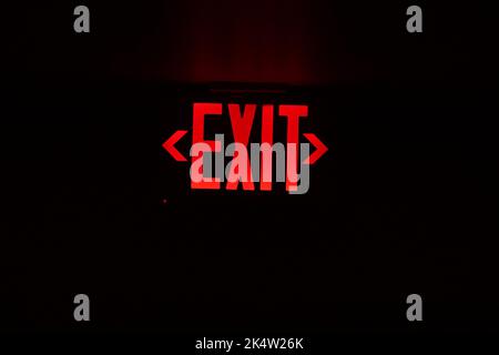 exit red light sign on black background Stock Photo