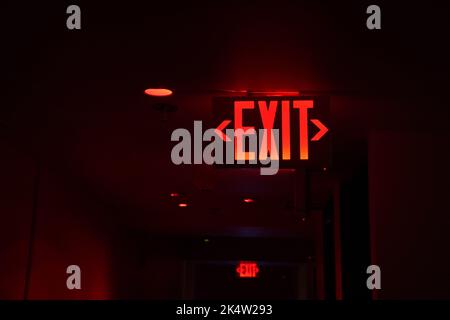 exit red light sign on black background Stock Photo