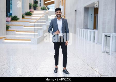 Confident young businessman in an office building Stock Photo