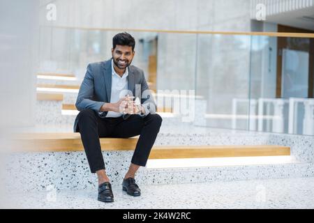 Confident young businessman in an office building Stock Photo