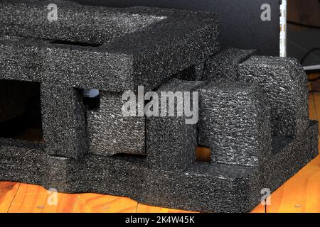 Close up polyethylene foam, black protective sponge, expanded polyethylene for transportation and packaging shock proofing foam sheet with air bubbles Stock Photo