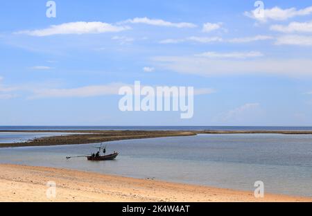 Panorama view of small fishing boat prepare to the sea, Fishermen in small fishing boat under beautiful blue sky. Stock Photo