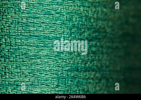 Abstract background of dark green  Fabric texture. Empty fabric background of soft and smooth textile material. Focused at left of fabric. Stock Photo