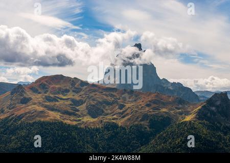 The Pic du Midi d'Ossau hidden behind some clouds and culminates at 2884 meters, west of the French Pyrenees Stock Photo