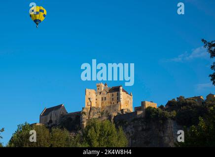 hot air balloon above the castle of Beynac in the Dordogne area in France Stock Photo