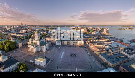 Helsinki Cityscape. Finland. Helsinki Cathedral, Old Town and Harbor in Background. Sunset Colors. Drone Point of View. Stock Photo