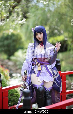 Portrait Of A Beautiful Young Woman Game Cosplay With Samurai Dress Costume  On Japanese Garden Stock Photo - Download Image Now - iStock